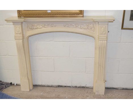 A modern composite fire surround and mantel in the Georgian style