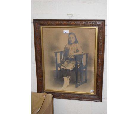 Early 20th Century portrait photograph of a seated young lady