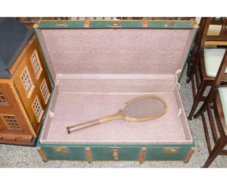 A vintage wooden bound trunk and a tennis racket