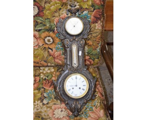 Wainwright &amp; Co, Birmingham, a Victorian iron cased combination aneroid barometer, thermometer and clock, the case repute
