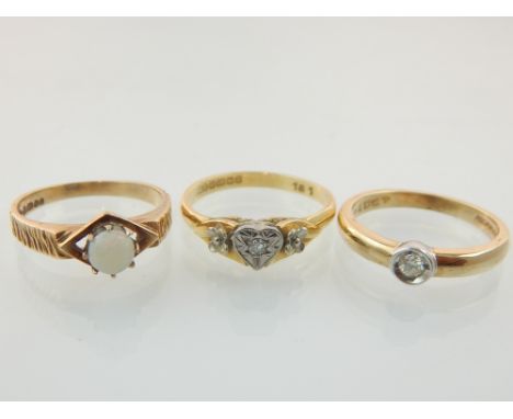 An 18ct gold and diamond ring, a 9ct gold and diamond ring together with a 9ct gold and opal ring. (3)