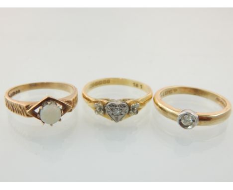 An 18ct gold and diamond ring, a 9ct gold and diamond ring together with a 9ct gold and opal ring. (3)