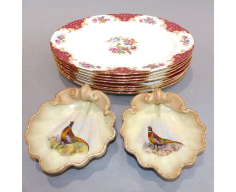Eight Ridgway 'Paragon' pheasant decorated oval serving plates and two Worcester 'pheasant' shell dishes, signed W. Stanton. 