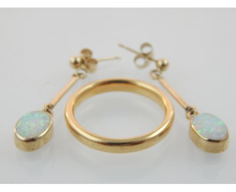 Pair of yellow metal opal drop ear pendants and an unmarked yellow gold band.