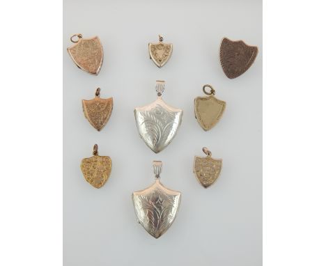 Nine Victorian and later yellow metal and silver shield shaped portrait lockets, one converted to a brooch.