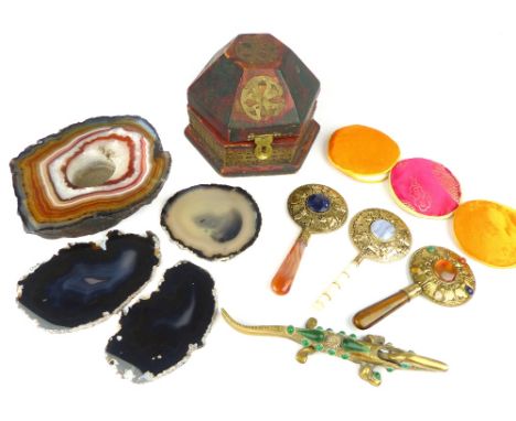 Three Chinese hand mirrors, the circular plates within a brass and hardstone frame, two with hardstone handles, the third wit