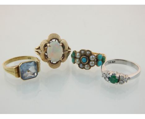 18ct white gold emerald and diamond seven stone ring, a Victorian turquoise seed pearl ring, an 18ct yellow gold opal dress r