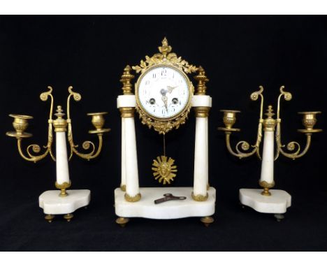 19th century white marble garniture, the gilt metal mounted portico clock with eight day movement striking on a bell, painted