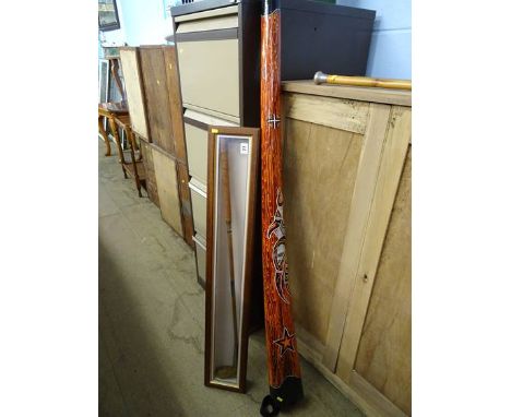 Didgeridoo, walking cane and a golf club