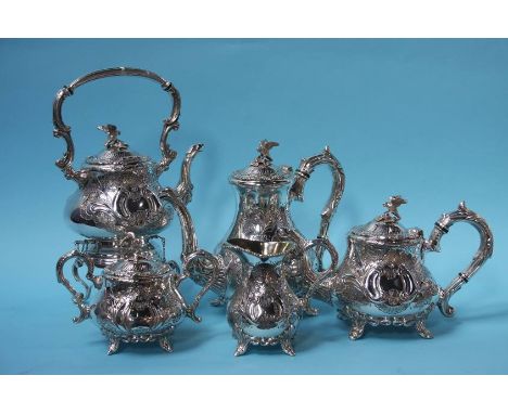 A five piece silver plated tea and coffee service comprising; milk jug, sugar bowl, tea pot, coffee pot and a spirit kettle, 