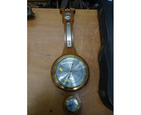 Violin and case and a barometer