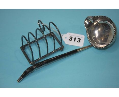 A silver toddy ladle and a four division toast rack