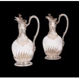 TETARD FRERES: A FINE PAIR OF 19TH CENTURY SILVER AND CRYSTAL GLASS CLARET JUGS CIRCA 1880