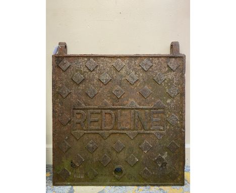 A rare Redline cast iron garage forecourt tank cover, 28 x 30". 