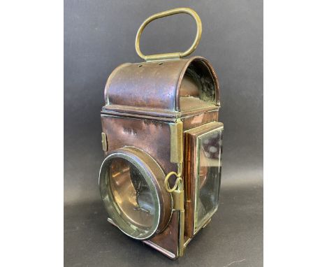 A large copper and brass mounted road locomotive lamp.