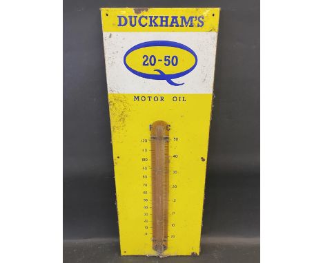 A Duckham's 20-50 Motor Oil enamel thermometer with original celluloid covering for the tube, 13 x 36". 