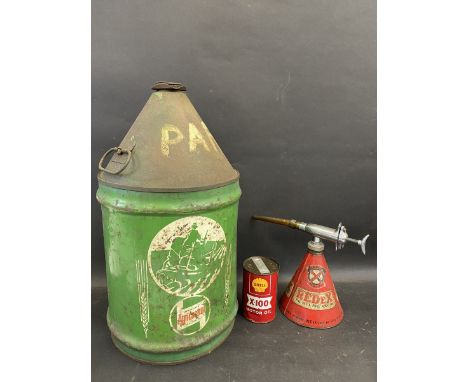 A Wakefield Agricultural five gallon can, a Redex additive gun and a Shell X-100 Motor Oil pint can. 