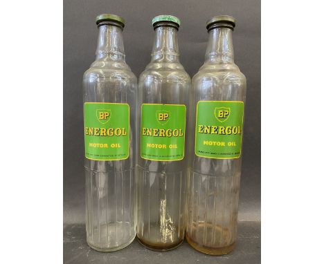 Three BP Energol Motor Oil quart glass bottles with caps. 
