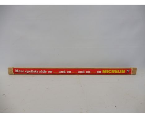 A 'More Cyclists ride on Michelin' tyres tin edge shelf strip, new old stock in near mint condition. 