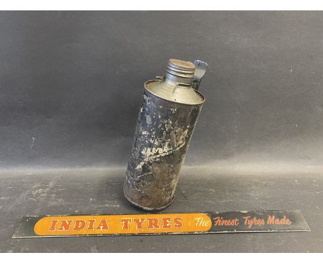 An India Tyres shelf strip and a Filtrate quart can on bulkhead bracket.