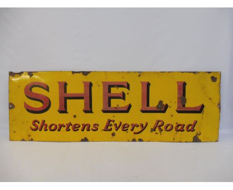A Shell 'Shortens Every Road' rectangular enamel sign, 54 x 18". 