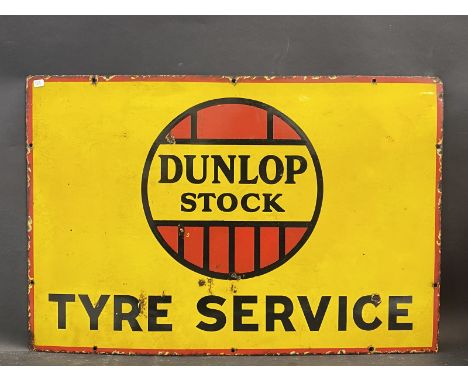 A Dunlop Stock rectangular enamel sign in good condition, 30 x 20".