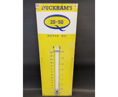 A Duckham's 20-50 Motor Oil enamel thermometer sign, lacking glass tube, 13 x 36".