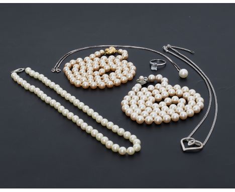 A mixed lot to include three strands of faux pearls, one stamped Christian Dior on the clasp, a 9k white gold ring set with a