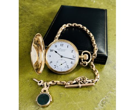 An early 20th century 9ct gold full hunter pocket watch with keyless movement, Everite, H. Samuel, Manchester, white enamel d