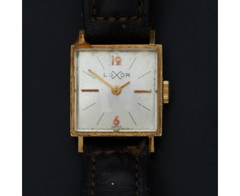 Luxor, a vintage 18ct yellow gold cased Luxor square shaped wristwatch on a leather strap, manual wind, total weight includin