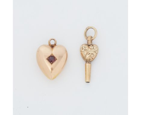 A yellow gold heart charm/pendant set with a round cut ruby, 1.93gm, (possibly 15ct but the hallmark is indistinct), and a ye
