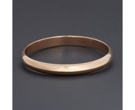 A plain 14k yellow gold hollow D-shaped bangle, circa 1930, diameter 8cm, 32.09gm, engraved inside 'From Orly 11.12.33', come