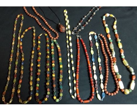 A multi-stone bead necklace, set with assorted round, rectangular, oval and other polished stone beads, including, agate, qua