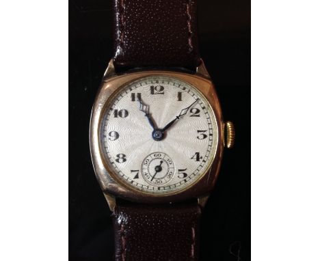 A vintage wrist watch, textured silvered dial, Arabic numerals, subsidiary seconds, 9ct B.W.C gold case, later brown leather 