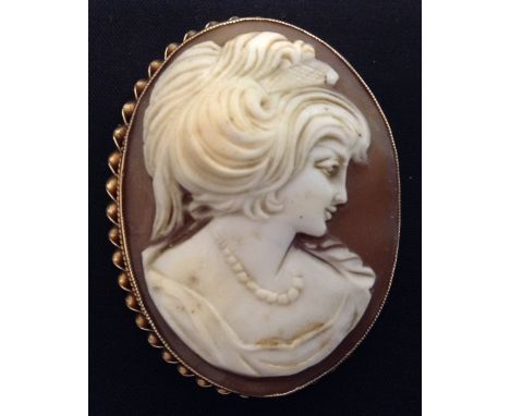 A Neoclassical Cameo portrait brooch, as a maiden, 9ct gold frame