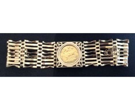 A 1911 sovereign panel gate bracelet, eight row gate link bangle, padlock clasp, 27.9g gross