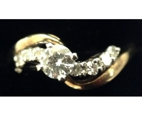 A diamond solitaire ring, quarter claw pinnacle set, the round brilliant diamond weight approx 0.30ct, arching yellow and whi