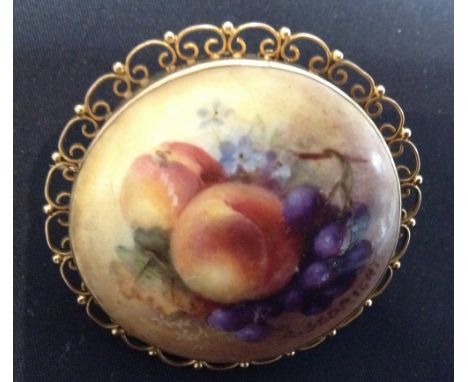 A Royal Worcester porcelain panel brooch, painted by R Seabright, with grapes, peaches and leaves, signed, date code 1921, 9c