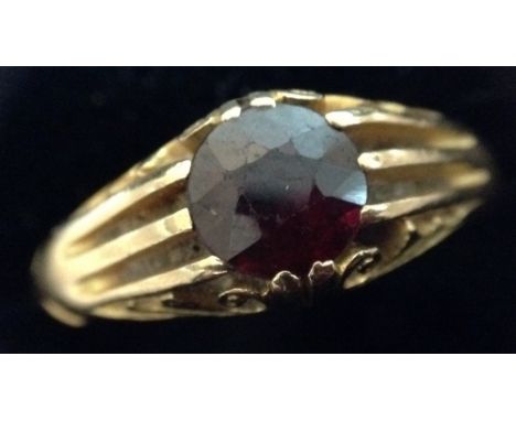 An Edwardian garnet gentleman's signet ring, set with a single red garnet, 18ct gold shank, size R, inscribed and dated 1905,