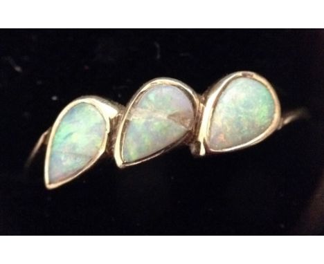 A 9ct gold and opal three stone dress ring, size K, 1.5g gross