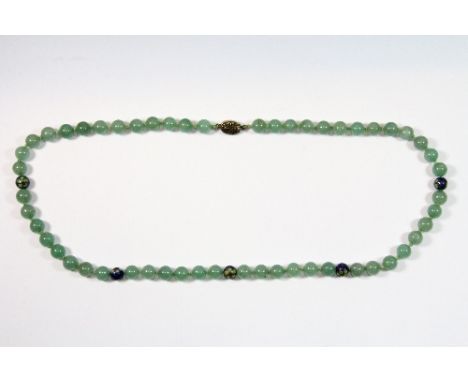 A single strand of pale green jade beads interspersed with cloisonné beads on a Chinese gilt filigree clasp