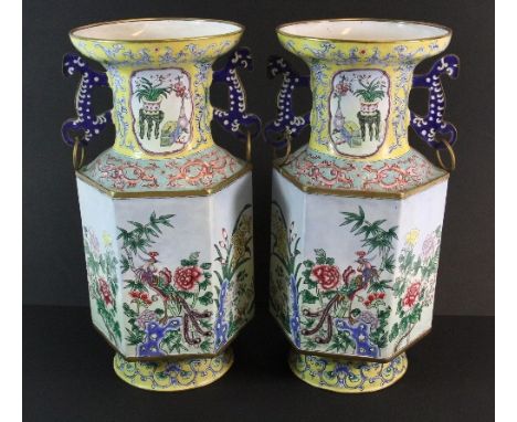 A pair of mid 20th century Chinese Canton enamel on copper hexagonal vases H 33cm