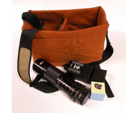 A Canon 100-200mm 1;5.6 zoom lens with a camera case a flash unit