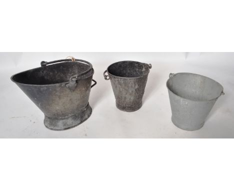A collection of railway coal scuttle / fire buckets. (1) Large black steel waterloo bucket, stamped B.R. (2) A black galvanis