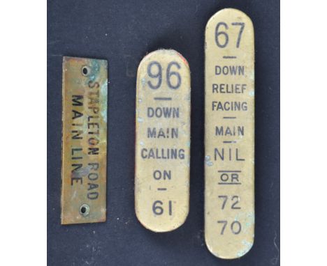 A collection of Railway lever plates and signs. To include: two brass lever plates numbered: 67 and 96,&nbsp;And a brass shel