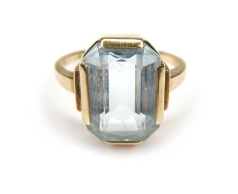 A 14ct gold Aquamarine style stone ring, the emerald cut stone 13 by 10mm, the band stamped 585, L/M, 5.4g. 