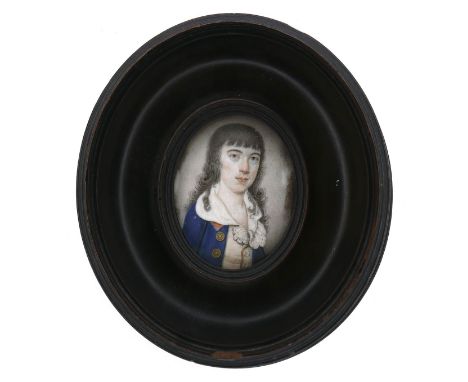 A portrait miniature on ivory depicting a boy in a blue coat with long black hair, possibly 17th century, 4.7 by 3.6cm, in la