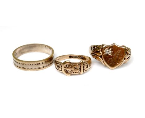 A group of three gold rings, the first a 14ct bi-colour gentleman's ring, size T/V, 4.4g, the second a 9ct signet ring with a