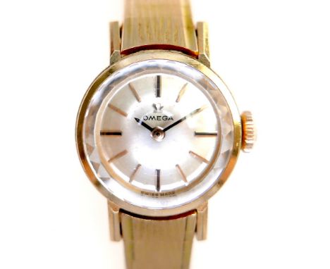 An Omega 18K gold cased lady's wristwatch, circa 1960s, model 511.042, the circular champagne dial with gold and black index 