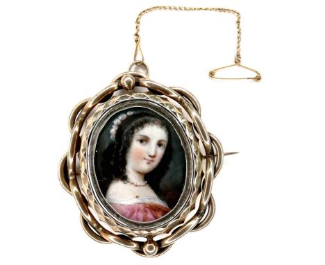 An early 19th century gold framed portrait miniature brooch, depicting a girl in a pink dress, swivel set with a lock of hair